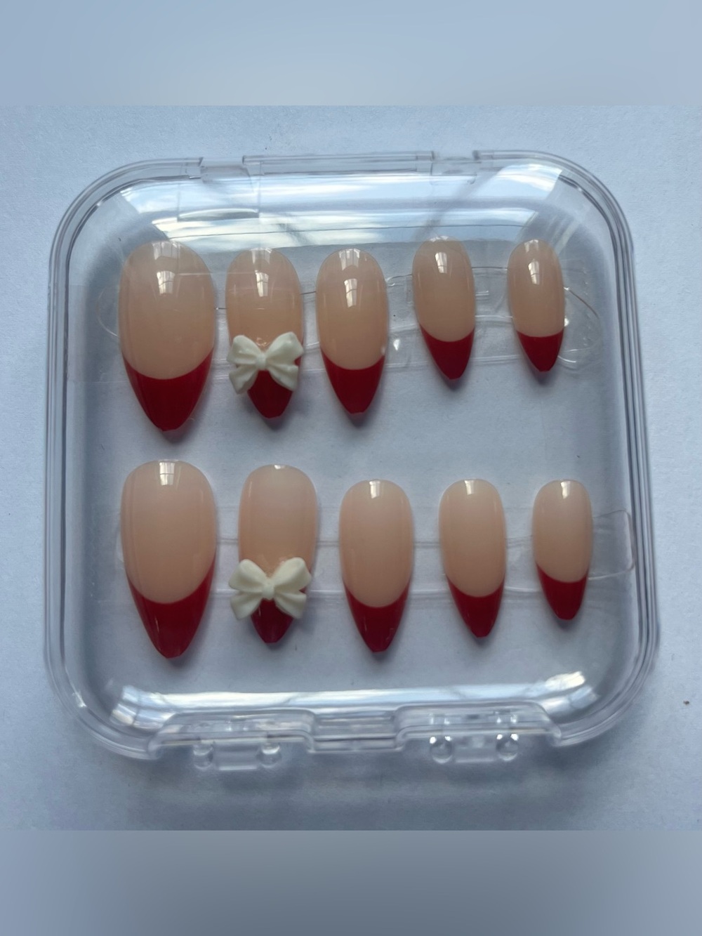 Nude & Red French Tip Press-On Nails with White Bow Accent